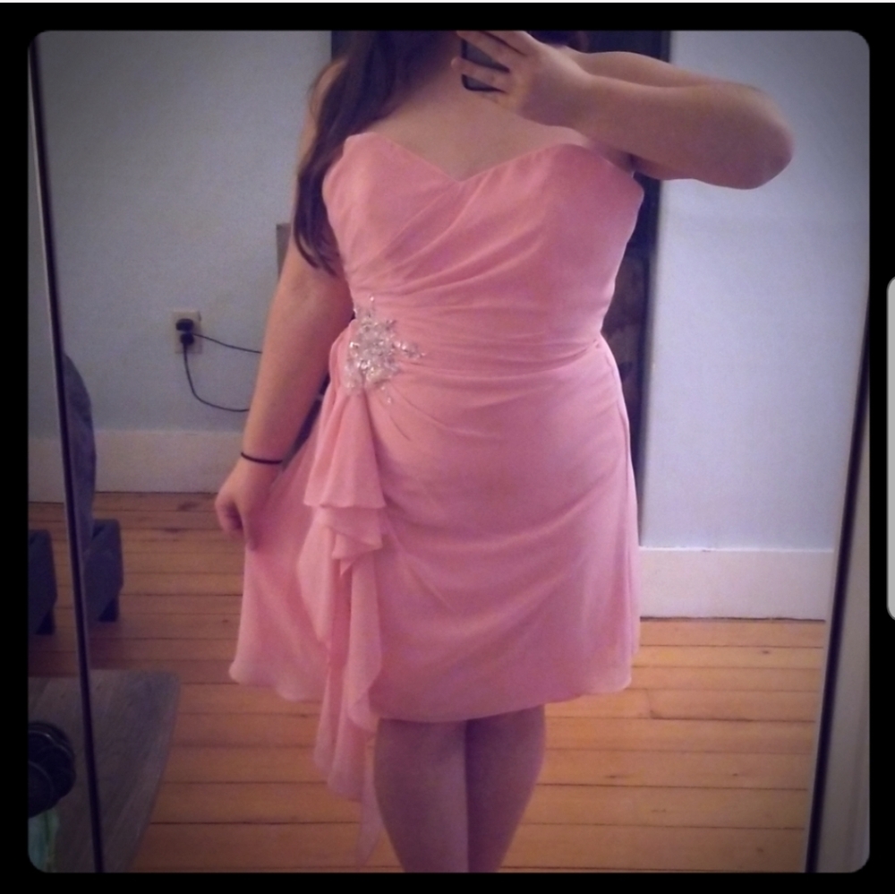 A short pink knee length dress.